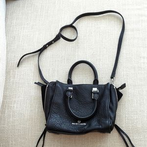 Vince Camuto black purse with zippers detail and cross body strap